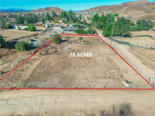 a view of swimming pool with a yard and large trees