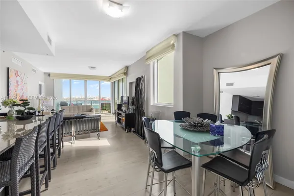 a view of a dining room with furniture and a livingroom
