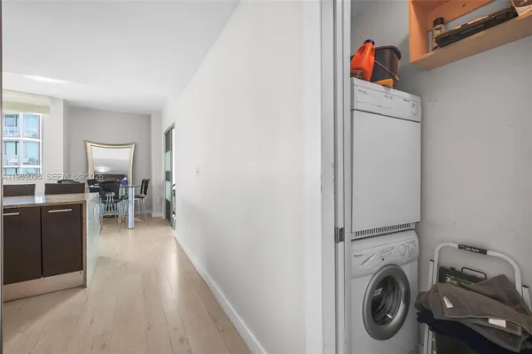 a view of a kitchen with washer and dryer