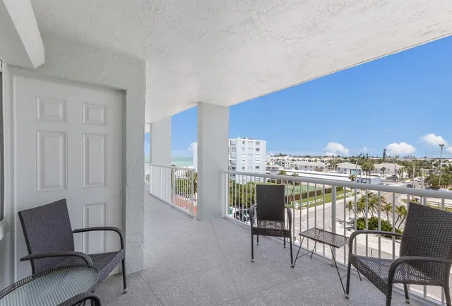 a kitchen with stainless steel appliances granite countertop a sink dishwasher stove and refrigerator with wooden floor