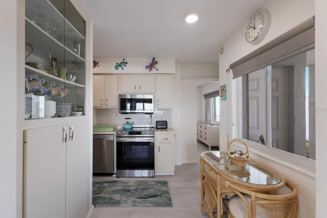 a dining room with furniture and a chandelier