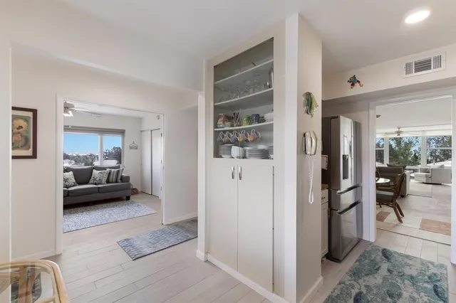 a bedroom with a large bed and a large window