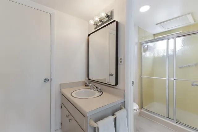 a living room with furniture a rug and a window