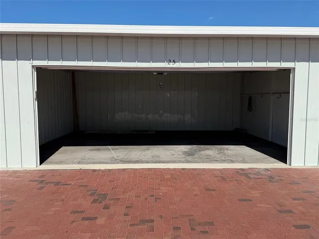 a view of a dining room and livingroom with furniture wooden floor and a rug