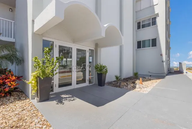 a view of an chairs and table in the porch