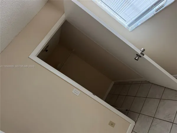 a white refrigerator freezer and a stove sitting inside of a kitchen
