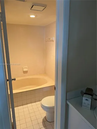 a view of a room that has a bed