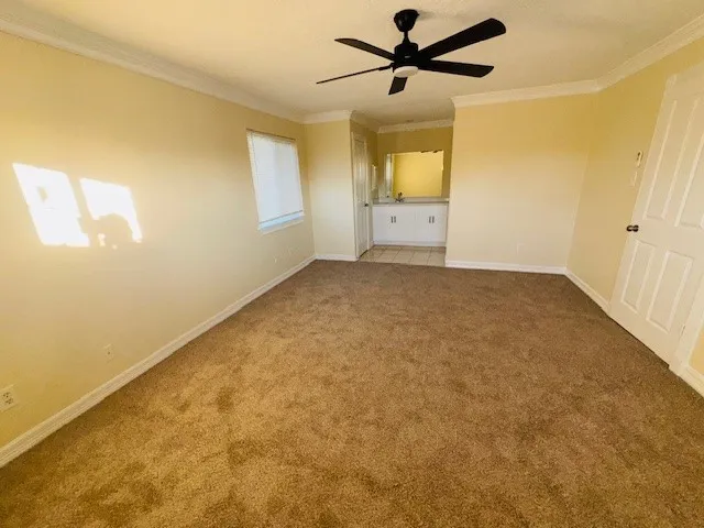 an empty room with a empty space and windows