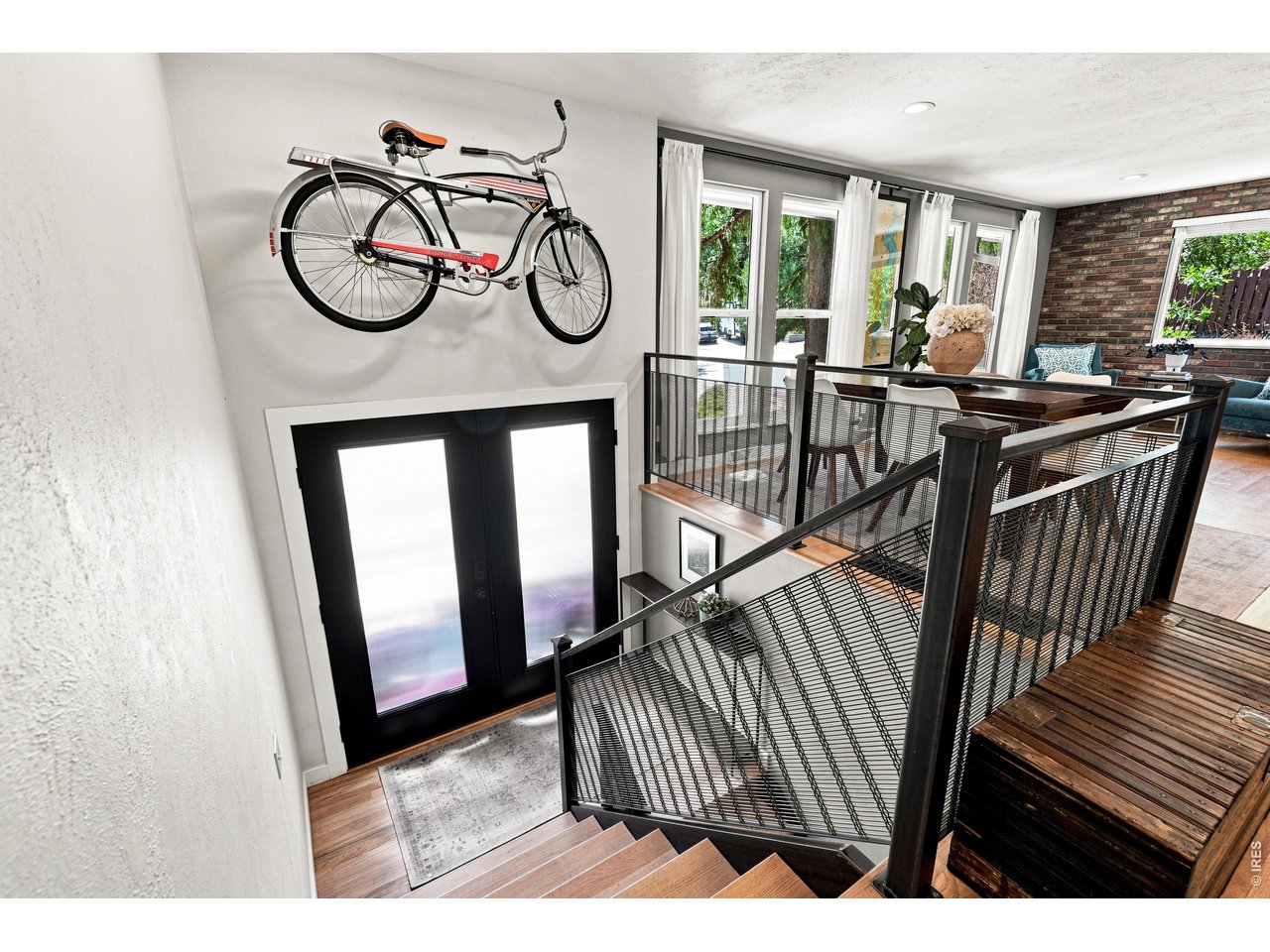 1964 Foothills Road Golden, CO 80401 - Photo 14 of 50 Steel mesh railing and open treads carry the architectural detail upstairs.