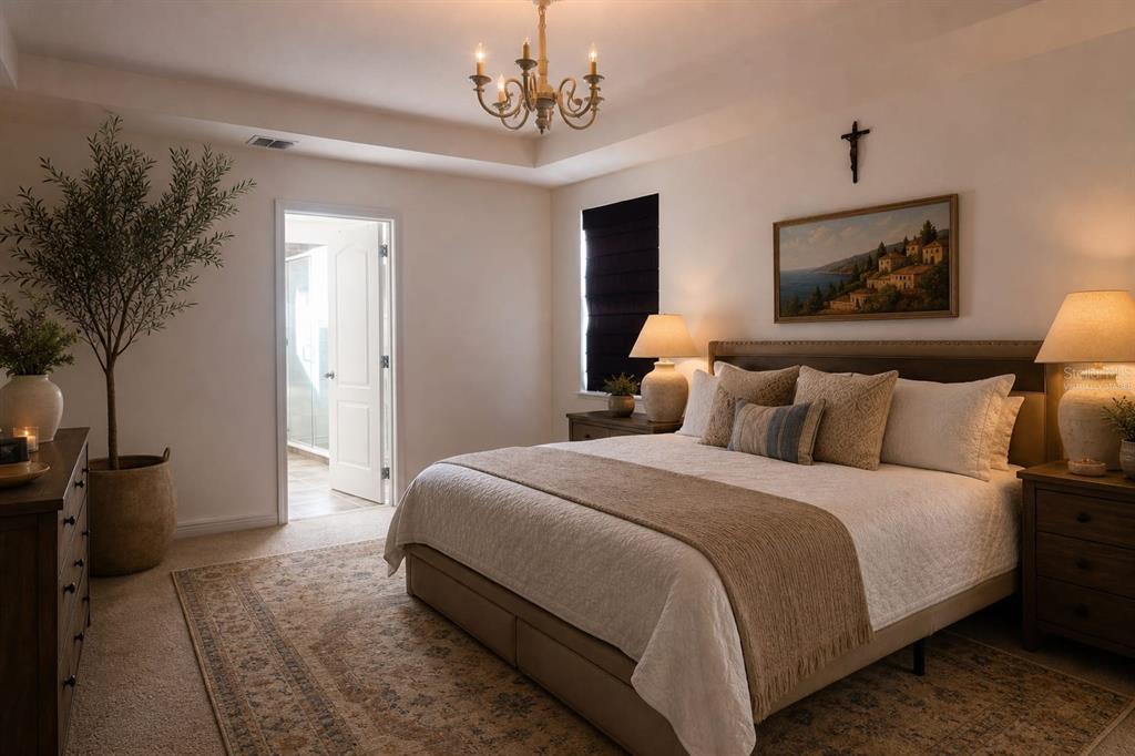 3837 Spring Creek Road Dundee, FL 33838 - Photo 12 of 15 a bedroom with bed and a chandelier
