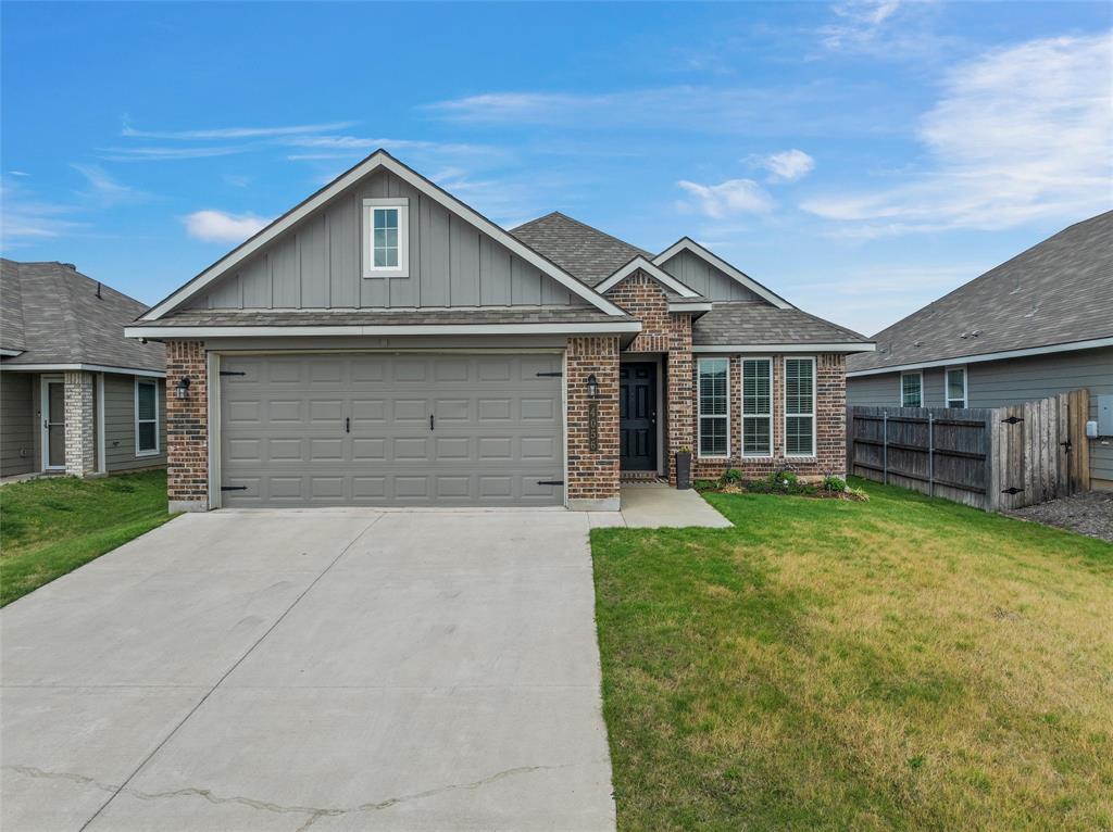 4056 Centerfire Road Waco, TX 76705 - Photo 2 of 27 a front view of a house with a garden and yard