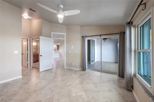 a view of a hallway with wooden shelves