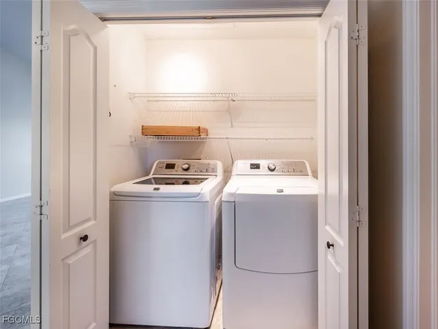 a utility room with dryer and washer