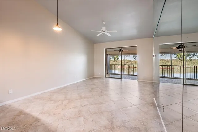 a view of an empty room with glass door