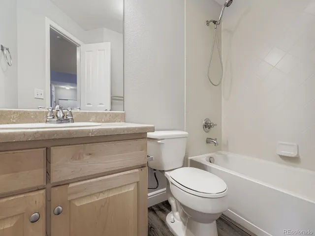 a bathroom with a sink a toilet and a bathtub