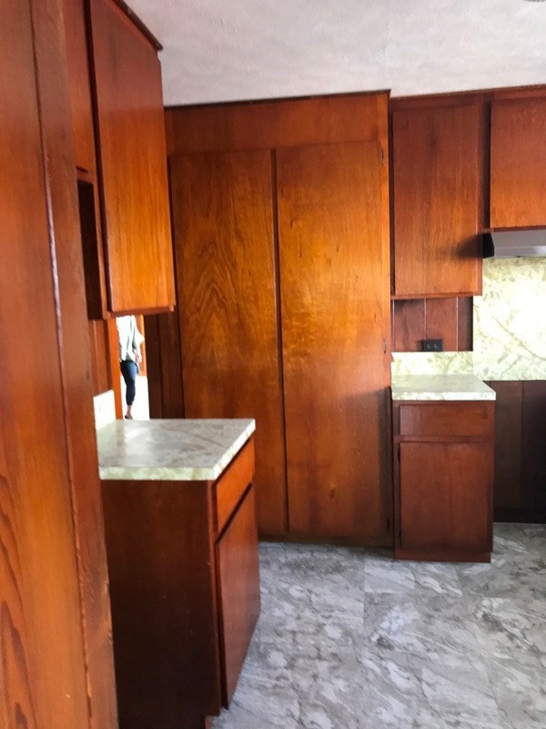 744 A Wainaku Street Hilo, HI 96720 - Photo 15 of 23 a kitchen with stainless steel appliances granite countertop a sink stove and cabinets