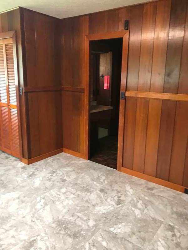 744 A Wainaku Street Hilo, HI 96720 - Photo 17 of 23 a view of an empty room with wooden floor