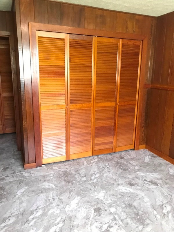 744 A Wainaku Street Hilo, HI 96720 - Photo 19 of 23 a view of an empty room with wooden door