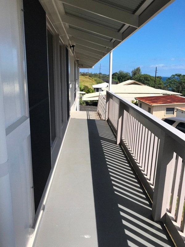 744 A Wainaku Street Hilo, HI 96720 - Photo 6 of 23 a view of a balcony with chairs