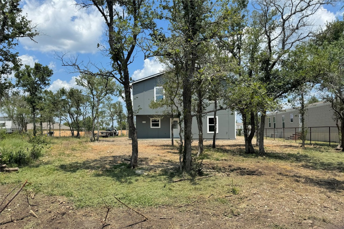 128 Passion Vine Rd Dale Dale, TX 78616 - Photo 30 of 30 a view of a yard with a tree