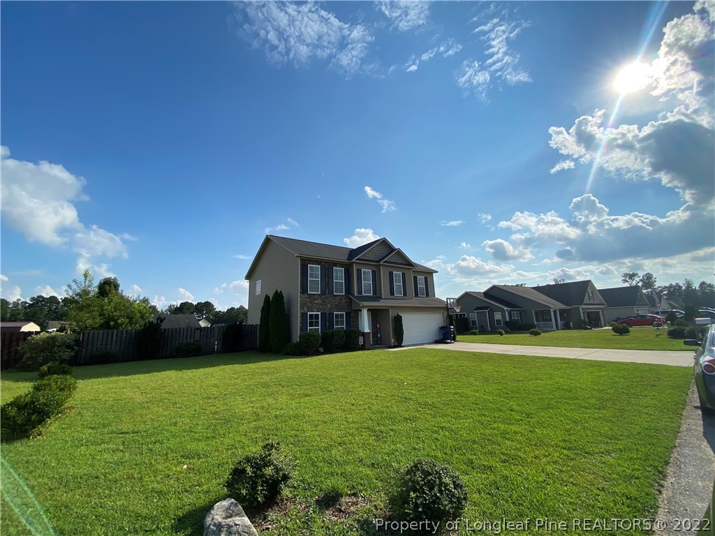269 Declaration Drive Raeford, NC 28376 - Photo 2 of 26 a view of a house with a big yard