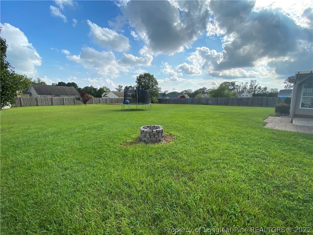 269 Declaration Drive Raeford, NC 28376 - Photo 25 of 26 a view of a golf course with a lake