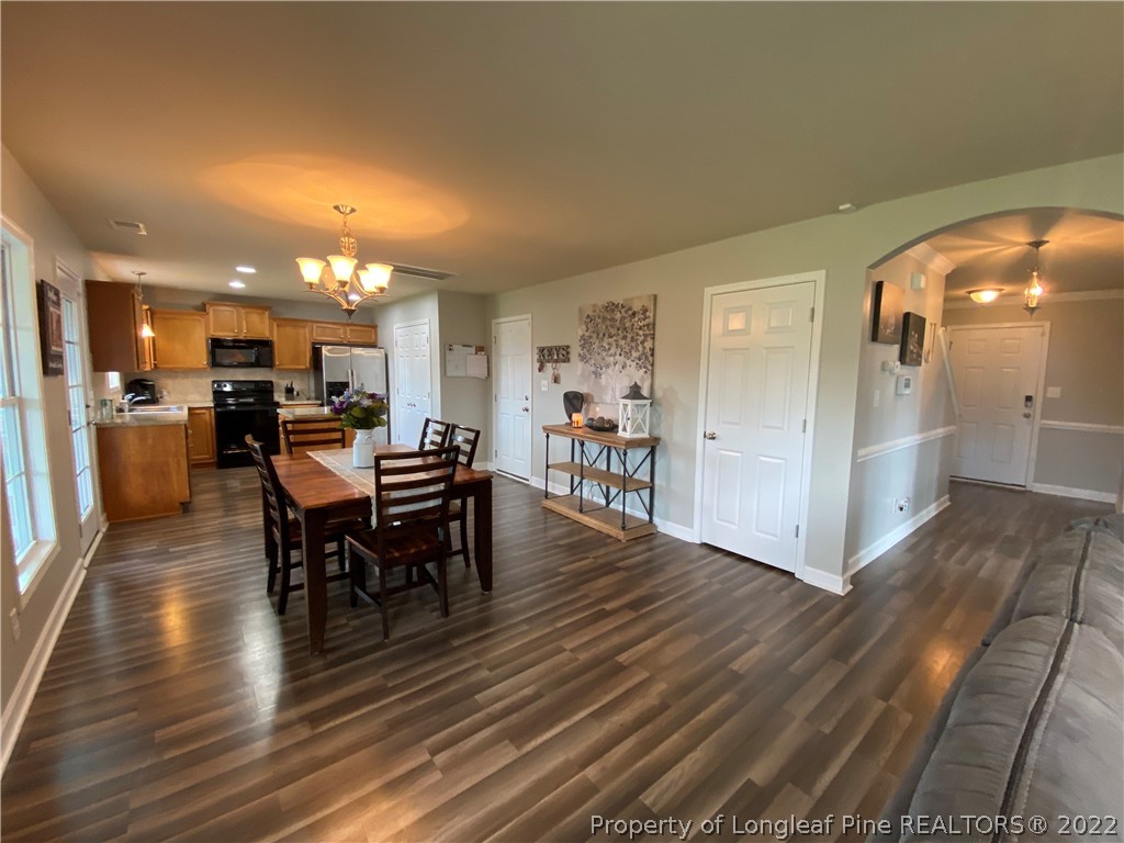 269 Declaration Drive Raeford, NC 28376 - Photo 4 of 26 a view of a dining room with furniture and wooden floor