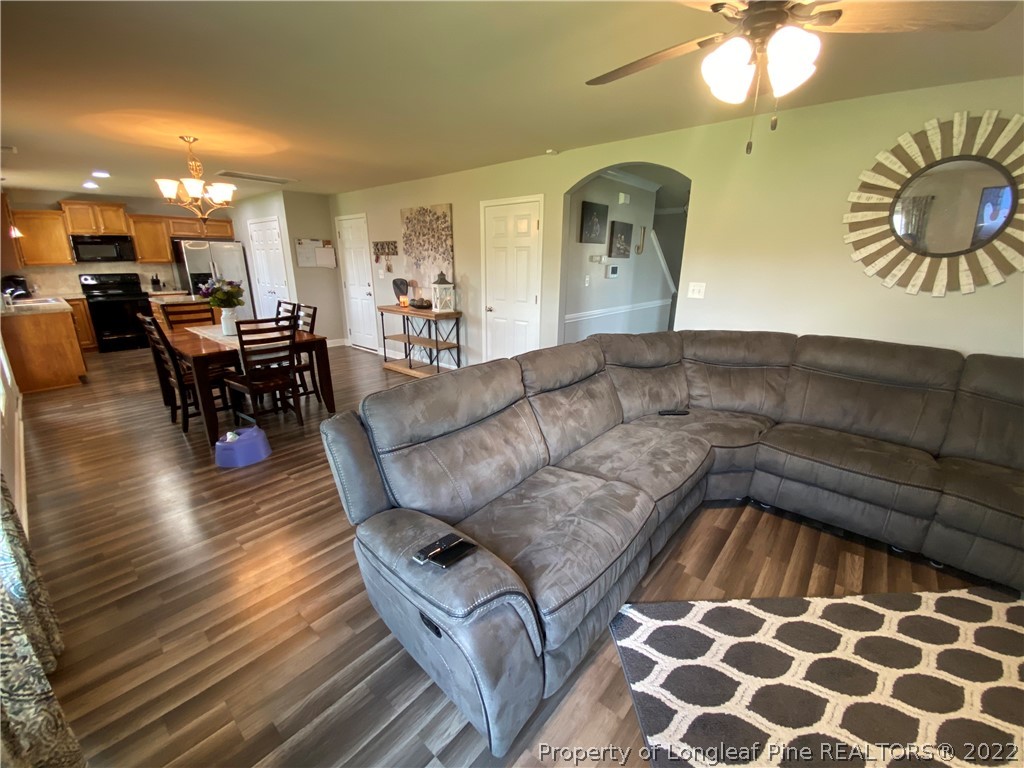 269 Declaration Drive Raeford, NC 28376 - Photo 8 of 26 a living room with furniture and wooden floor