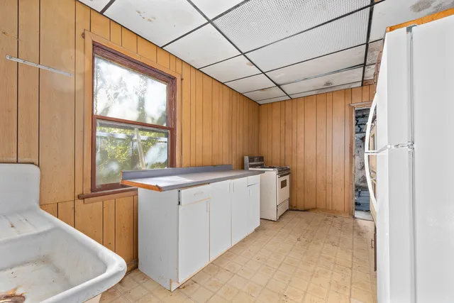 a kitchen with a sink and refrigerator