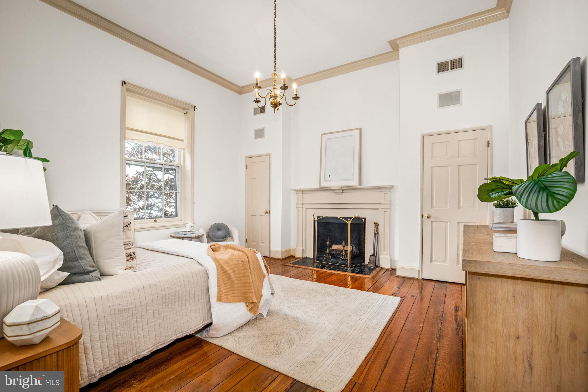 3316 N Street Northwest Washington, DC 20007 - Photo 13 of 18 a living room with furniture fireplace and wooden floor