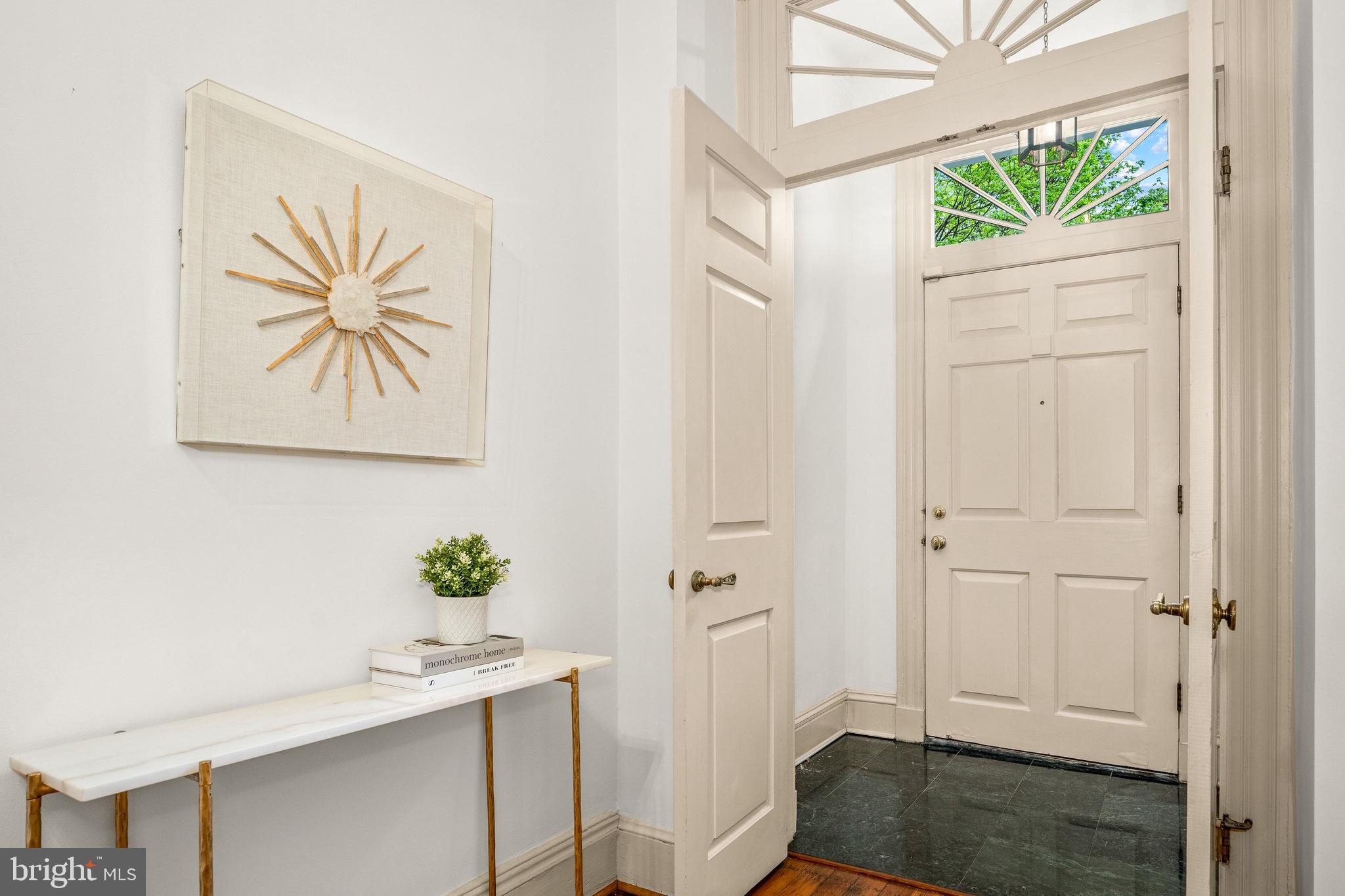 3316 N Street Northwest Washington, DC 20007 - Photo 2 of 18 a view of a hallway that has a plant in it