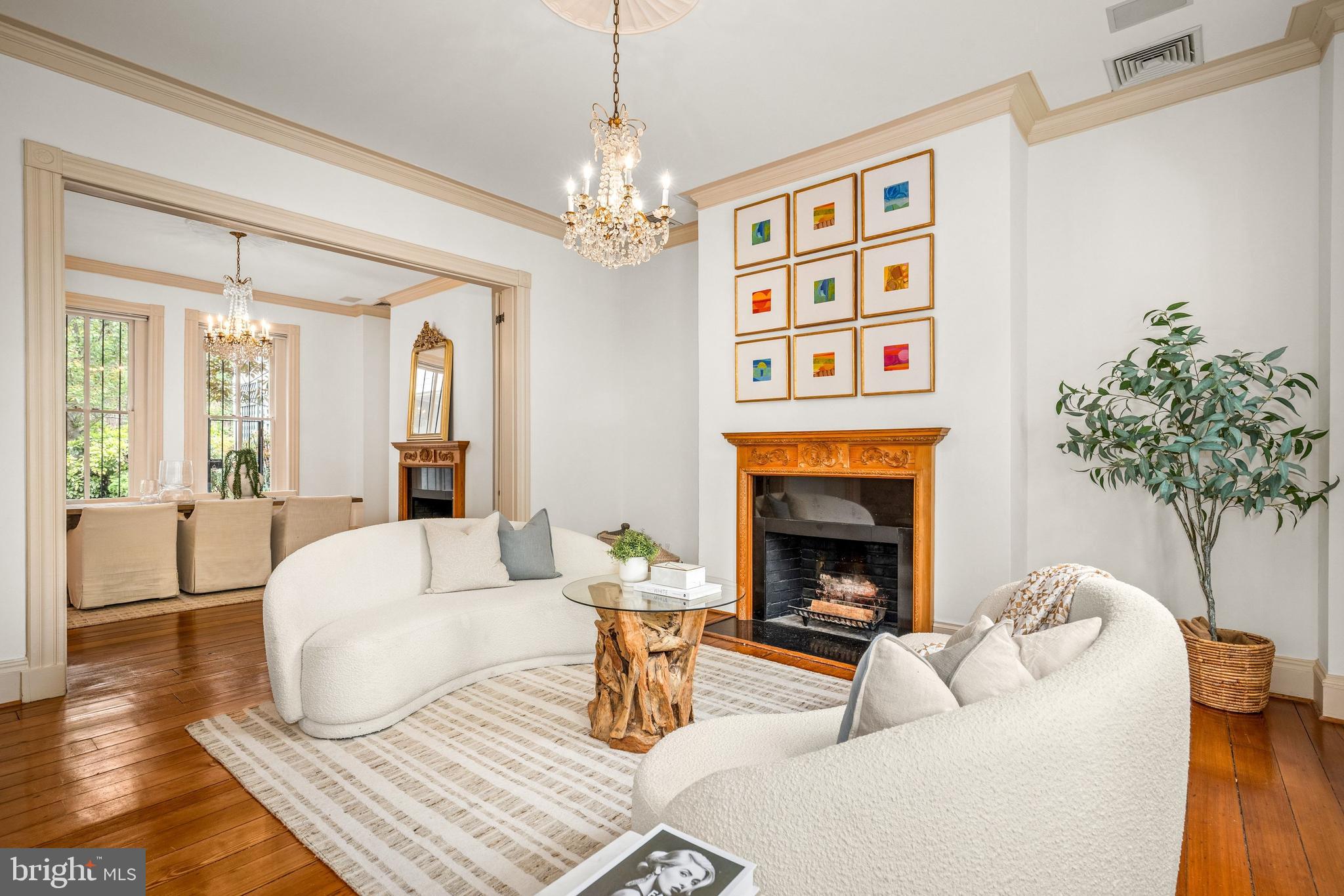 3316 N Street Northwest Washington, DC 20007 - Photo 5 of 18 a living room with furniture a fireplace and a chandelier
