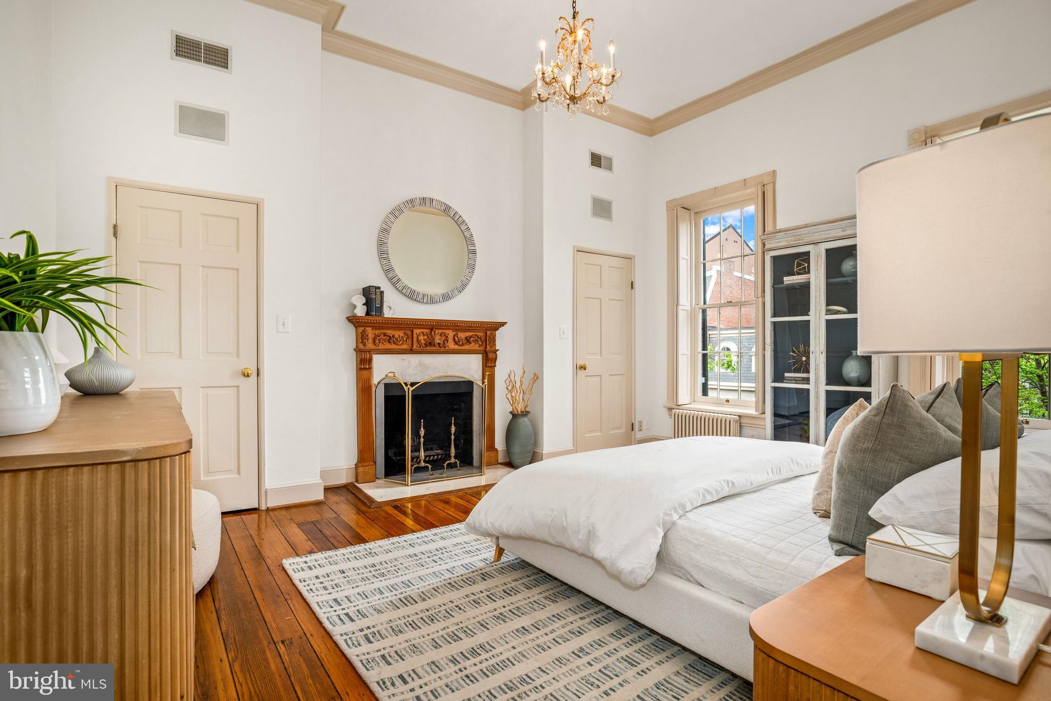 3316 N Street Northwest Washington, DC 20007 - Photo 10 of 18 a bedroom with a bed and a fireplace