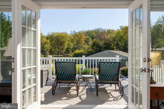 a view of a balcony with chairs
