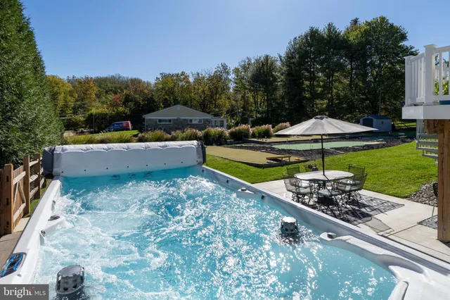 a view of a backyard with a patio and outdoor seating