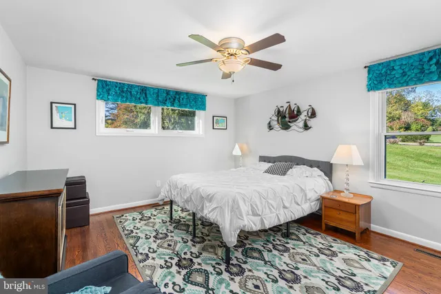 a bed room with a bed and a window