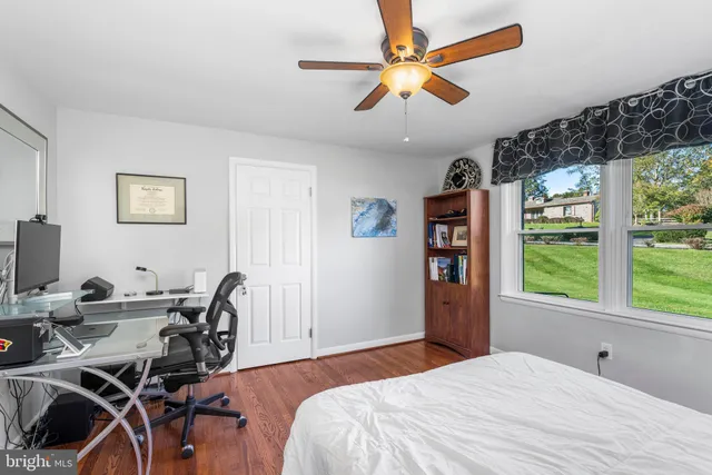 a bedroom that has a bed and a window