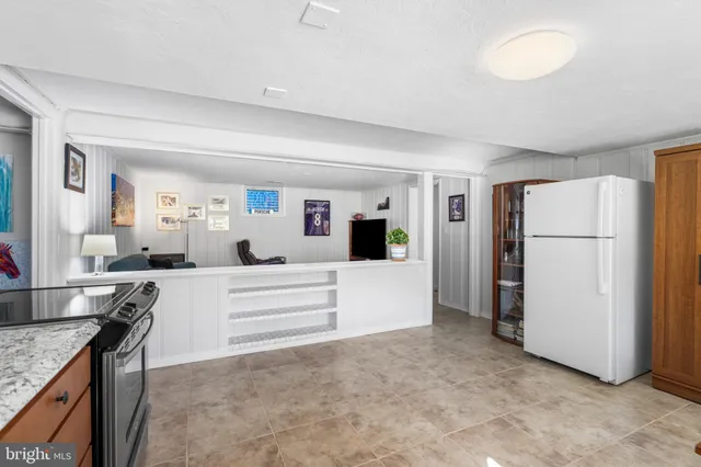 a bedroom with furniture and a flat screen tv