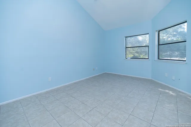 an empty room with windows