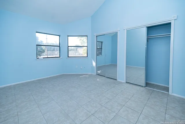 an empty room with windows