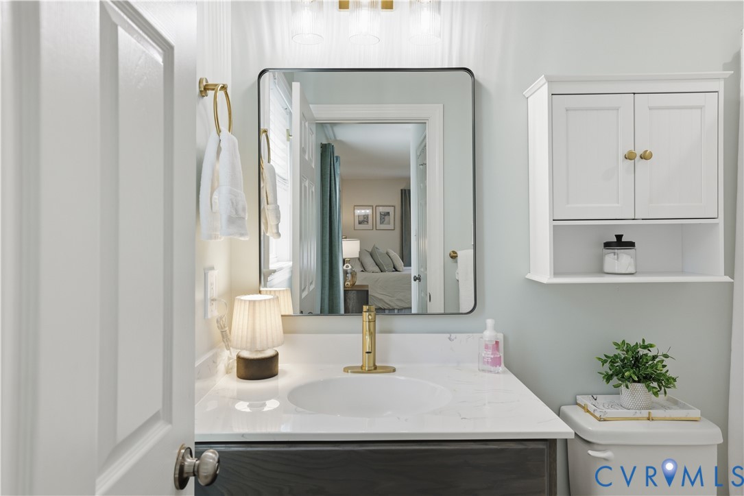 222 Oak Ridge Court Aylett, VA 23009 - Photo 19 of 35 Bathroom vanity featuring a rectangular framed mir