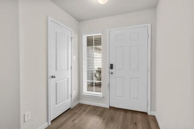 wooden floor with white walls