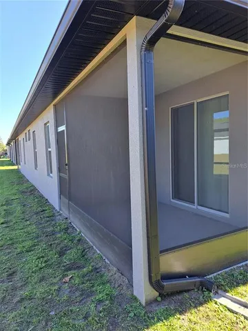 a view of house with backyard