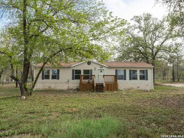 135 Savannah Ridge Von Ormy, TX 78073 - Photo 6 of 45 a house that is sitting in middle of the grass