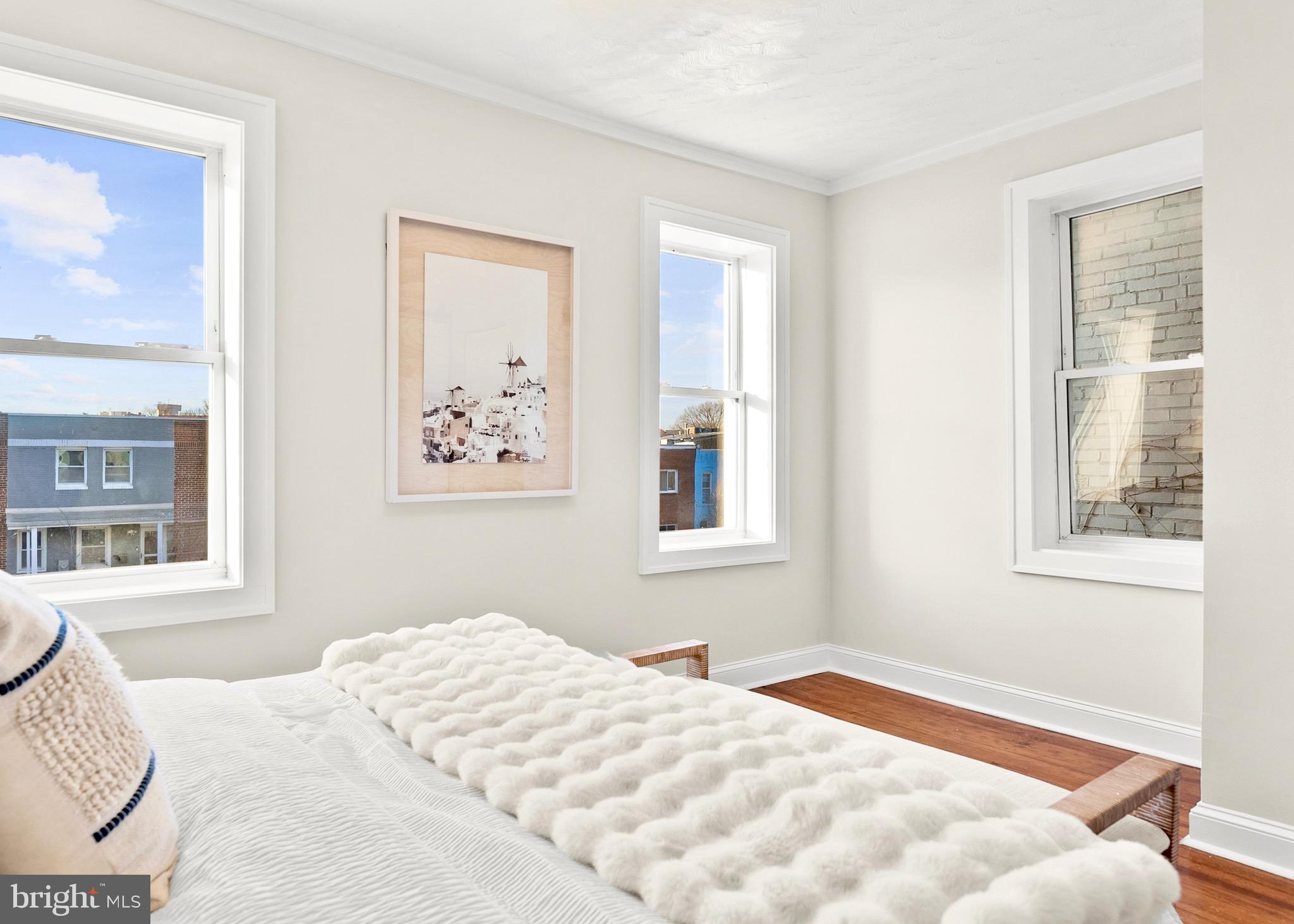 1627 Montello Avenue Northeast Washington, DC 20002 - Photo 8 of 17 a bedroom with a bed and a window