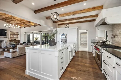 a kitchen with stainless steel appliances a sink and cabinets