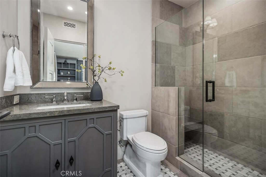 17 Pacific Ridge Place Dana Point, CA 92629 - Photo 21 of 47 a bathroom with a granite countertop sink a toilet and shower