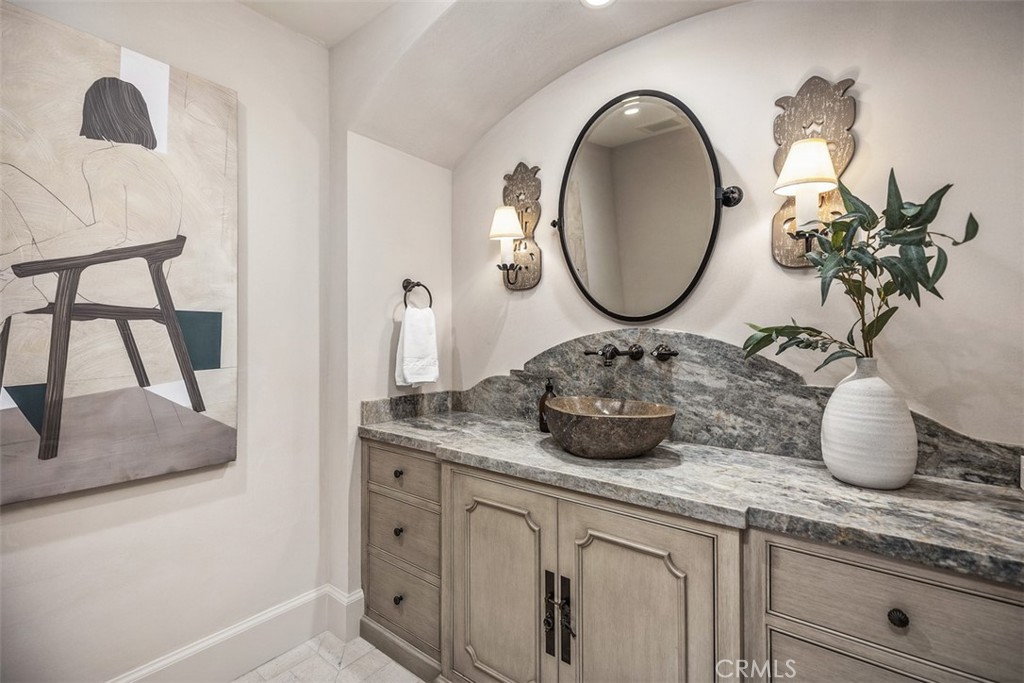 17 Pacific Ridge Place Dana Point, CA 92629 - Photo 30 of 47 a bathroom with a granite countertop sink and a mirror