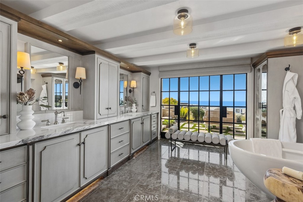 17 Pacific Ridge Place Dana Point, CA 92629 - Photo 33 of 47 a bathroom with a sink tub double vanity and chair