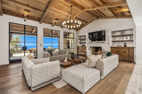 a living room with fireplace furniture and a flat screen tv